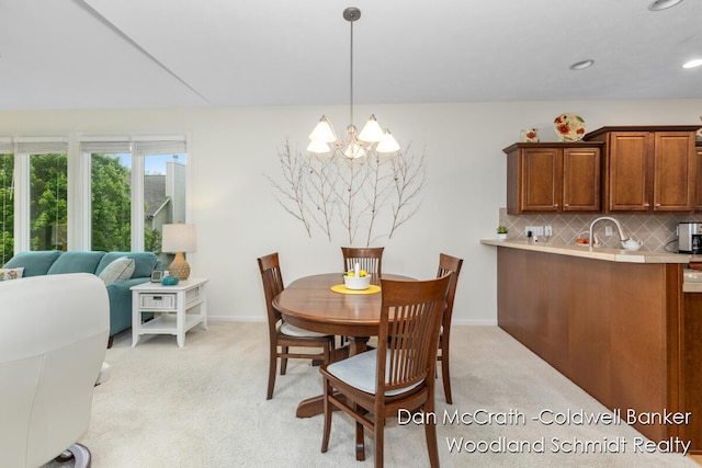 1809 Woodside Trl NW, Grand Rapids, MI 49504 - dining space featuring a chandelier and light colored carpet