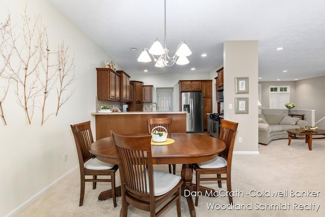 1809 Woodside Trl NW, Grand Rapids, MI 49504 - dining space with light carpet, a chandelier, and recessed lighting