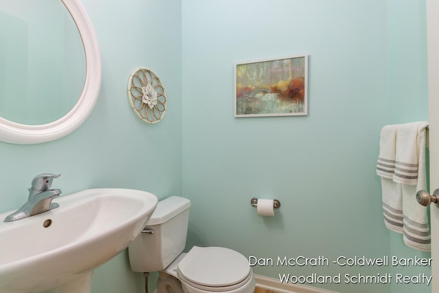1809 Woodside Trl NW, Grand Rapids, MI 49504 - half bath with a sink and toilet