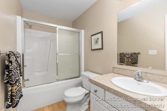 1809 Woodside Trl NW, Grand Rapids, MI 49504 - full bathroom featuring vanity, enclosed tub / shower combo, and wood finished floors