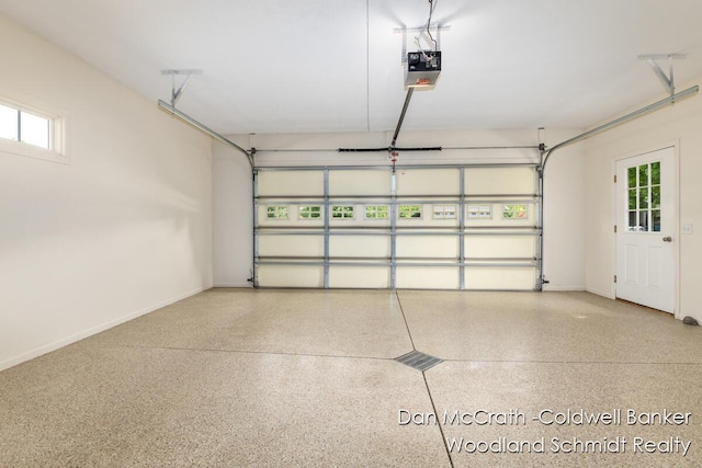 1809 Woodside Trl NW, Grand Rapids, MI 49504 - garage featuring a garage door opener and baseboards