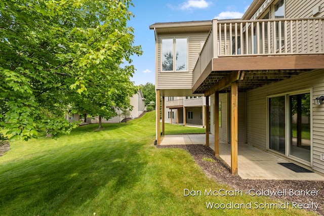 1809 Woodside Trl NW, Grand Rapids, MI 49504 - view of grassy yard with a patio and a wooden deck