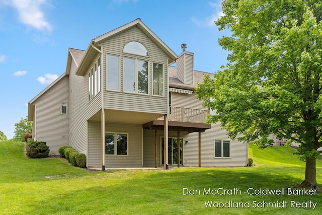 1809 Woodside Trl NW, Grand Rapids, MI 49504 - rear view of property with a lawn, a wooden deck, a chimney, and a shingled roof
