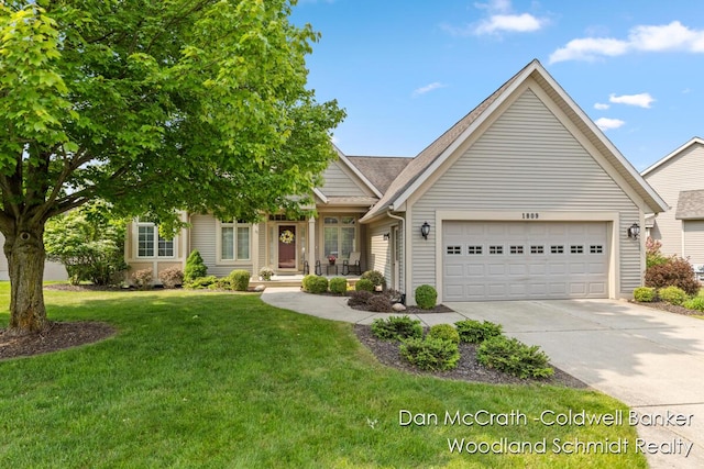 1809 Woodside Trl NW, Grand Rapids, MI 49504 - view of front of property featuring concrete driveway, a garage, and a front yard