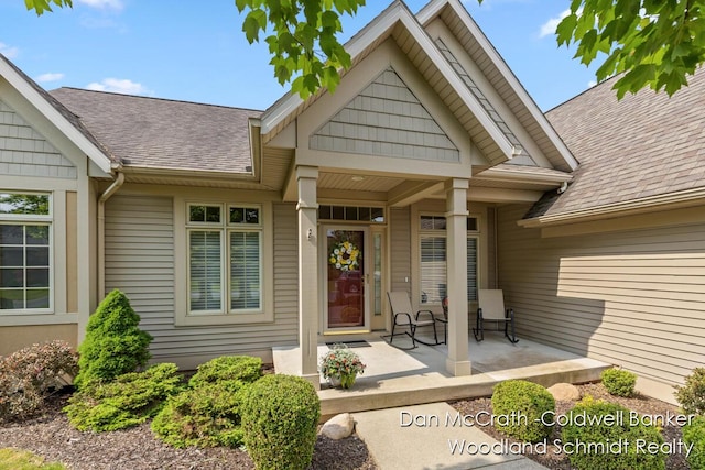 1809 Woodside Trl NW, Grand Rapids, MI 49504 - doorway to property with a porch and roof with shingles