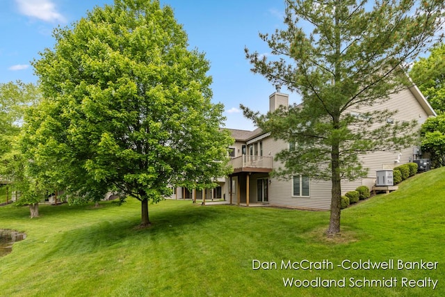 1809 Woodside Trl NW, Grand Rapids, MI 49504 - view of green lawn with a deck