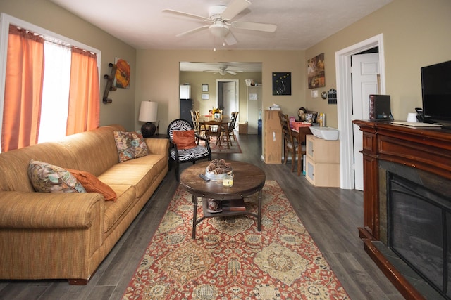 246 Powell St SE, Grand Rapids, MI 49507 - living area featuring dark wood-style floors, ceiling fan, and a glass covered fireplace