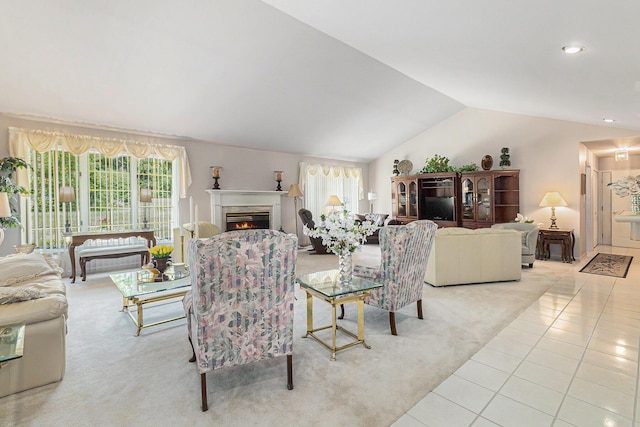 49202 Cheshire Ln, Canton, MI 48187 - living area featuring carpet flooring, vaulted ceiling, tile patterned floors, a warm lit fireplace, and recessed lighting