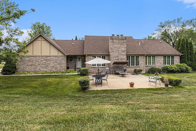 49202 Cheshire Ln, Canton, MI 48187 - back of property featuring a patio, a yard, a chimney, and roof with shingles