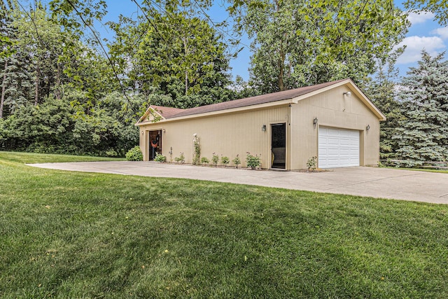 49202 Cheshire Ln, Canton, MI 48187 - view of side of home featuring a yard, a detached garage, and concrete driveway