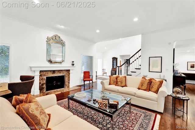 4768 Wendrick Dr, West Bloomfield, MI 48323 - living area featuring wood finished floors, recessed lighting, stairs, a premium fireplace, and ornamental molding