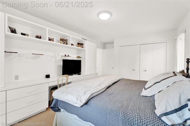 4768 Wendrick Dr, West Bloomfield, MI 48323 - bedroom featuring built in desk, light carpet, and a closet