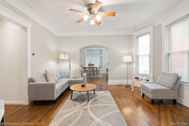 4751 Trumbull St, Detroit, MI 48208 - living area featuring arched walkways, a ceiling fan, plenty of natural light, and wood finished floors