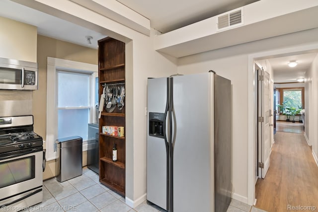 4751 Trumbull St, Detroit, MI 48208 - kitchen with appliances with stainless steel finishes and baseboards