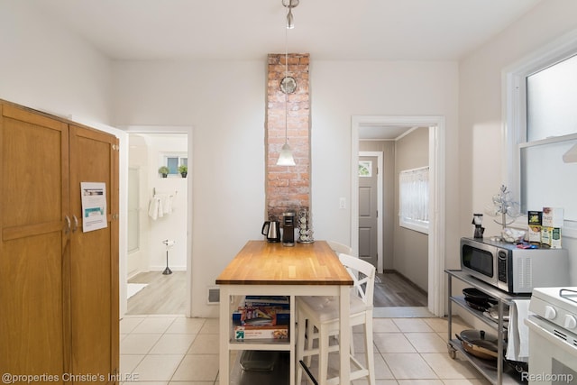 4751 Trumbull St, Detroit, MI 48208 - dining area featuring light tile patterned floors