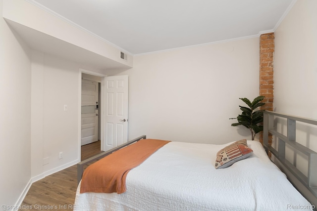 4751 Trumbull St, Detroit, MI 48208 - bedroom featuring wood finished floors and crown molding