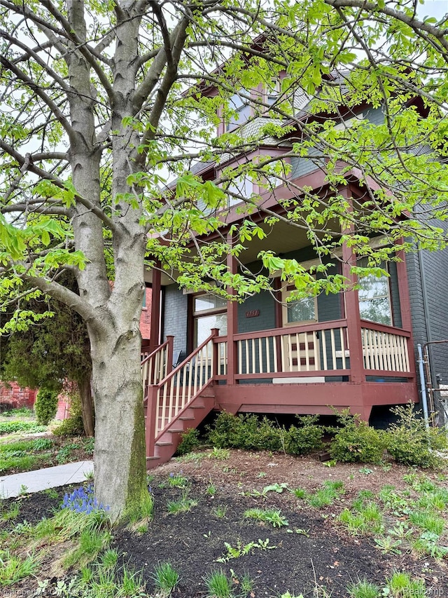 4751 Trumbull St, Detroit, MI 48208 - view of side of property with covered porch and brick siding