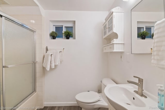 4751 Trumbull St, Detroit, MI 48208 - full bath featuring combined bath / shower with glass door and wood finished floors