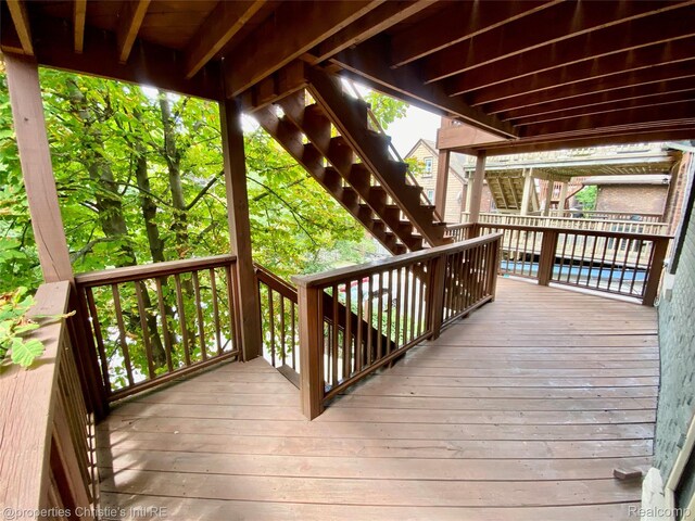 4751 Trumbull St, Detroit, MI 48208 - deck with stairway and a swimming pool