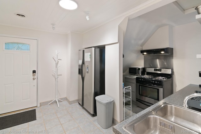 4751 Trumbull St, Detroit, MI 48208 - kitchen with stainless steel appliances, exhaust hood, light tile patterned flooring, and dark countertops