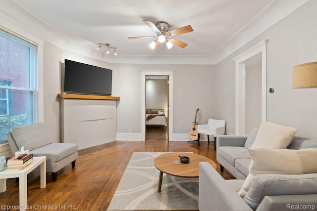 4751 Trumbull St, Detroit, MI 48208 - living area featuring ceiling fan, wood finished floors, and rail lighting