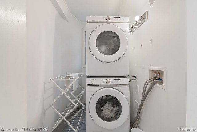 4751 Trumbull St, Detroit, MI 48208 - laundry room featuring stacked washing machine and dryer