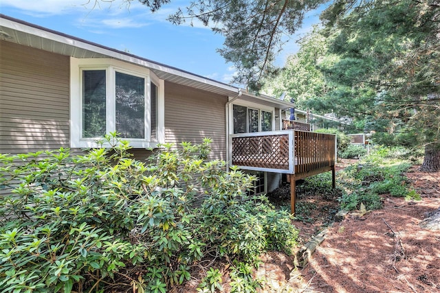3342 Woodwind Dr NE, Grand Rapids, MI 49525 - view of side of home featuring a wooden deck