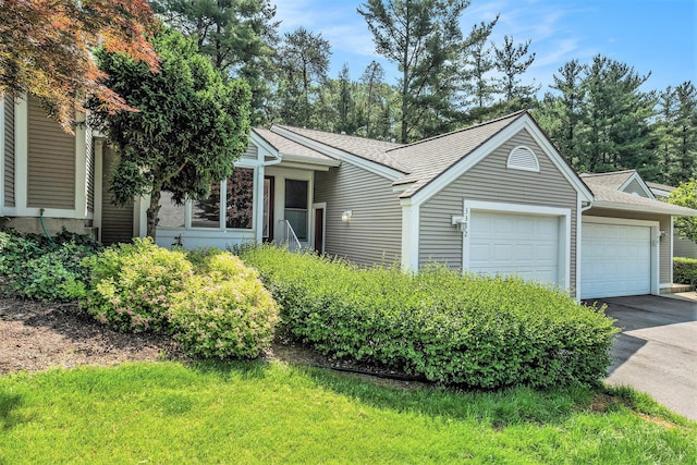 3342 Woodwind Dr NE, Grand Rapids, MI 49525 - single story home featuring an attached garage, concrete driveway, and a shingled roof