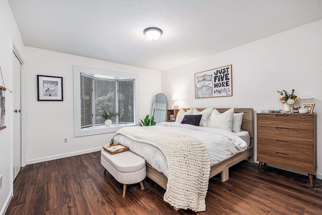 3342 Woodwind Dr NE, Grand Rapids, MI 49525 - bedroom with dark wood-style floors and a textured ceiling