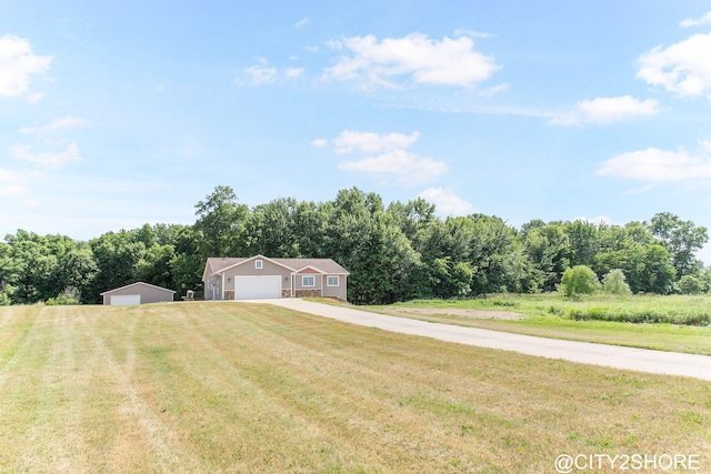 3905 Sunset Vw, Wayland, MI 49348 - view of green lawn with concrete driveway