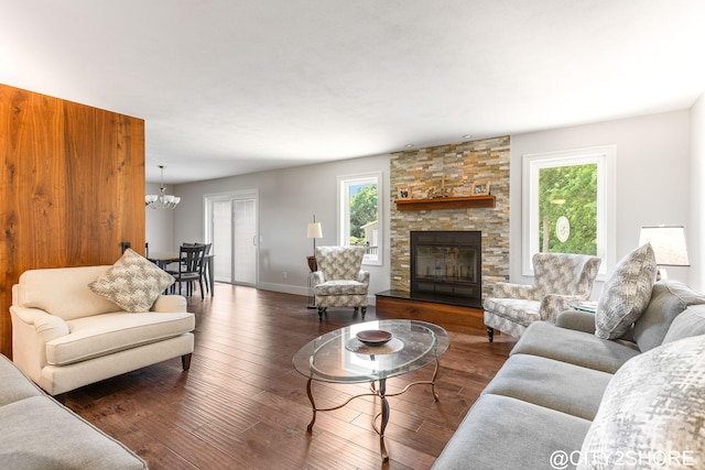 3905 Sunset Vw, Wayland, MI 49348 - living area featuring a chandelier, healthy amount of natural light, wood-type flooring, and a fireplace