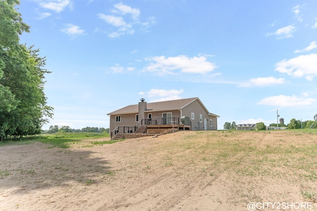 3905 Sunset Vw, Wayland, MI 49348 - back of property featuring a wooden deck and a chimney