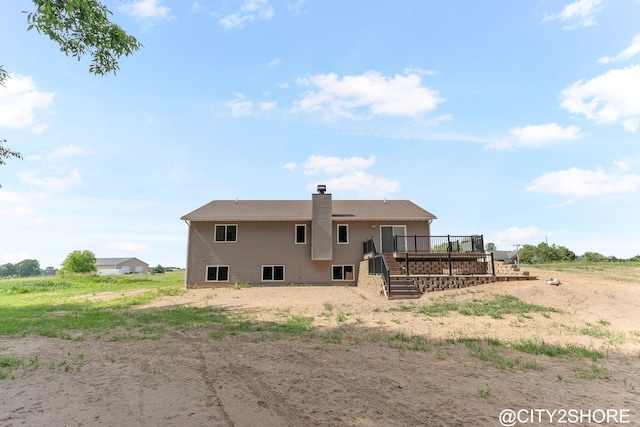 3905 Sunset Vw, Wayland, MI 49348 - back of property featuring a wooden deck and a chimney