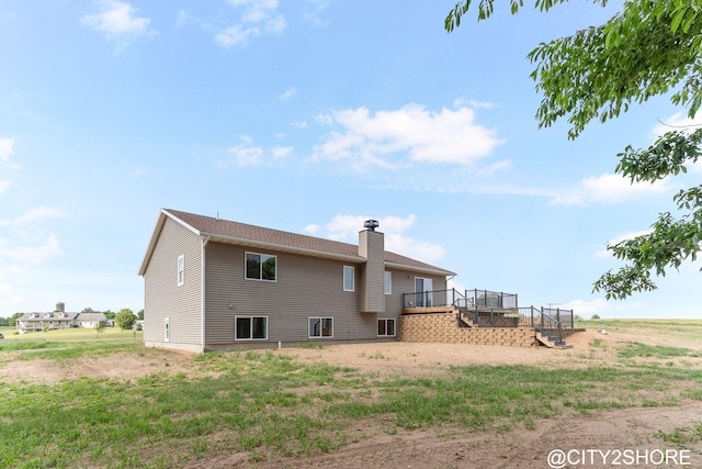 3905 Sunset Vw, Wayland, MI 49348 - back of house featuring a deck, stairway, and a chimney