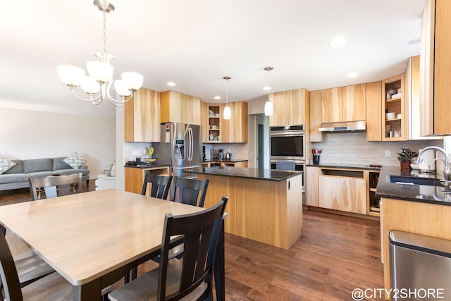 3905 Sunset Vw, Wayland, MI 49348 - kitchen with appliances with stainless steel finishes, light brown cabinets, a center island, tasteful backsplash, and recessed lighting