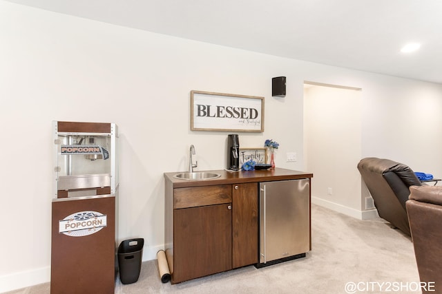 3905 Sunset Vw, Wayland, MI 49348 - indoor wet bar featuring refrigerator and light colored carpet