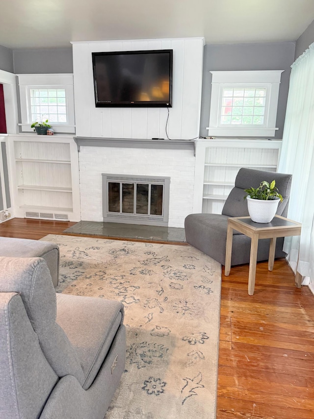 423 E Prairie St, Vicksburg, MI 49097 - living room featuring wood finished floors and a fireplace
