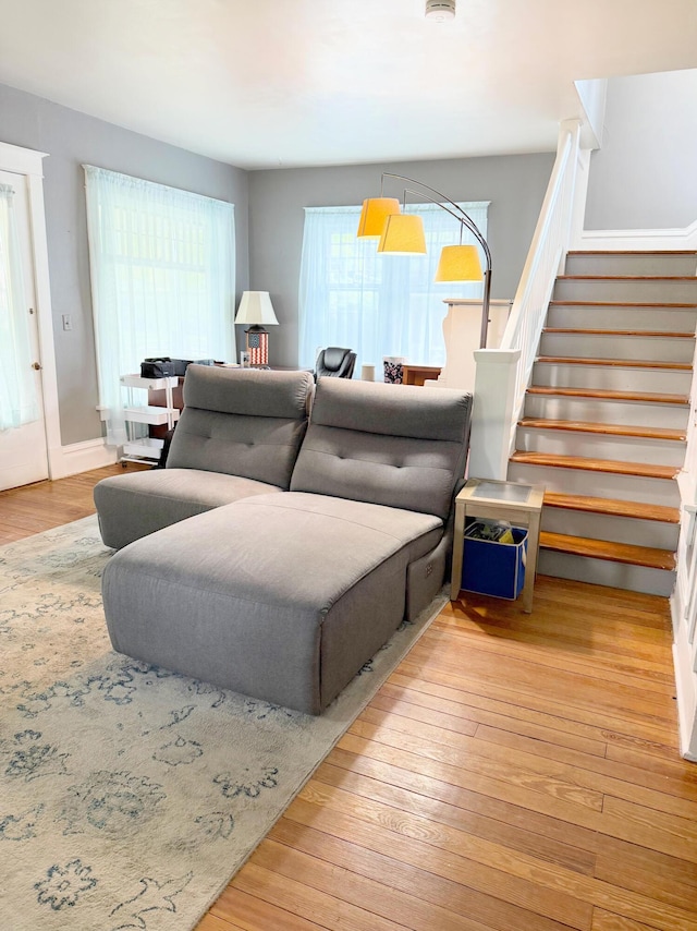 423 E Prairie St, Vicksburg, MI 49097 - living room with stairway and hardwood / wood-style floors