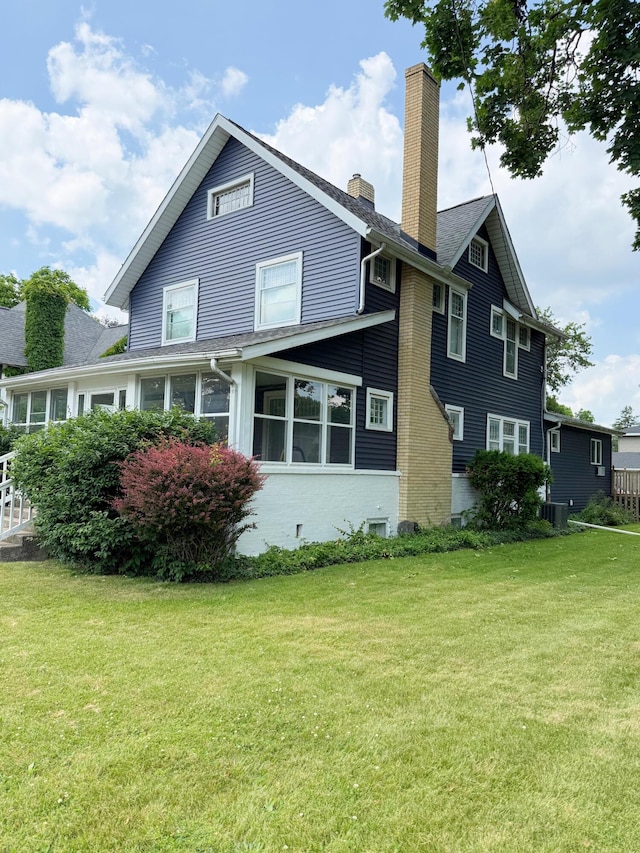 423 E Prairie St, Vicksburg, MI 49097 - view of side of home with a chimney and a lawn