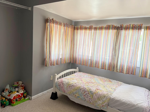 423 E Prairie St, Vicksburg, MI 49097 - carpeted bedroom featuring baseboards