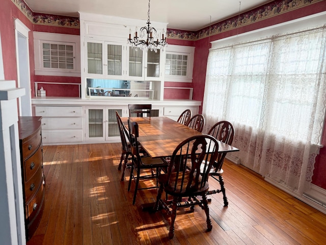 423 E Prairie St, Vicksburg, MI 49097 - dining space featuring wood-type flooring and a chandelier
