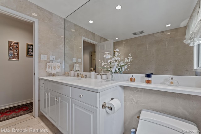130 Endicott Rd, Bloomfield Hills, MI 48304 - bathroom with tile walls, vanity, recessed lighting, and tile patterned floors