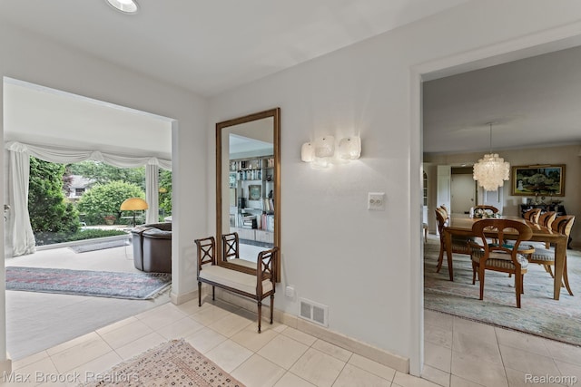 130 Endicott Rd, Bloomfield Hills, MI 48304 - hallway featuring a chandelier and light tile patterned floors