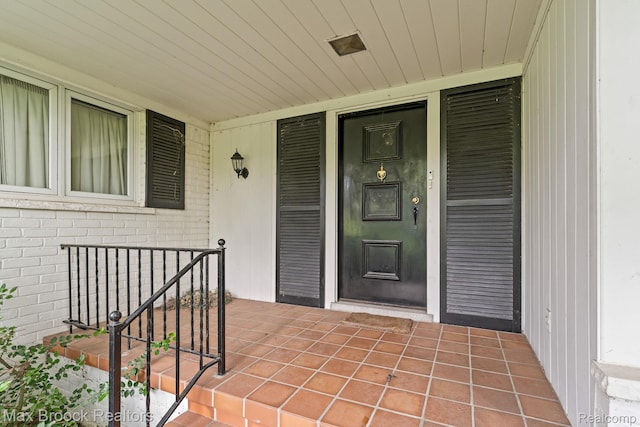 130 Endicott Rd, Bloomfield Hills, MI 48304 - property entrance featuring a porch and brick siding