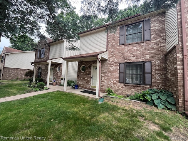 35754 Castlewood Ct, Westland, MI 48185 - traditional-style home with a front lawn and brick siding