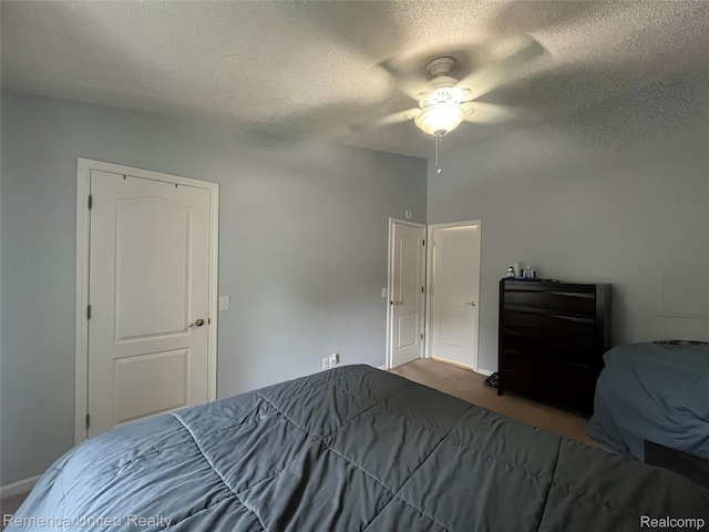 35754 Castlewood Ct, Westland, MI 48185 - carpeted bedroom with a textured ceiling and a ceiling fan