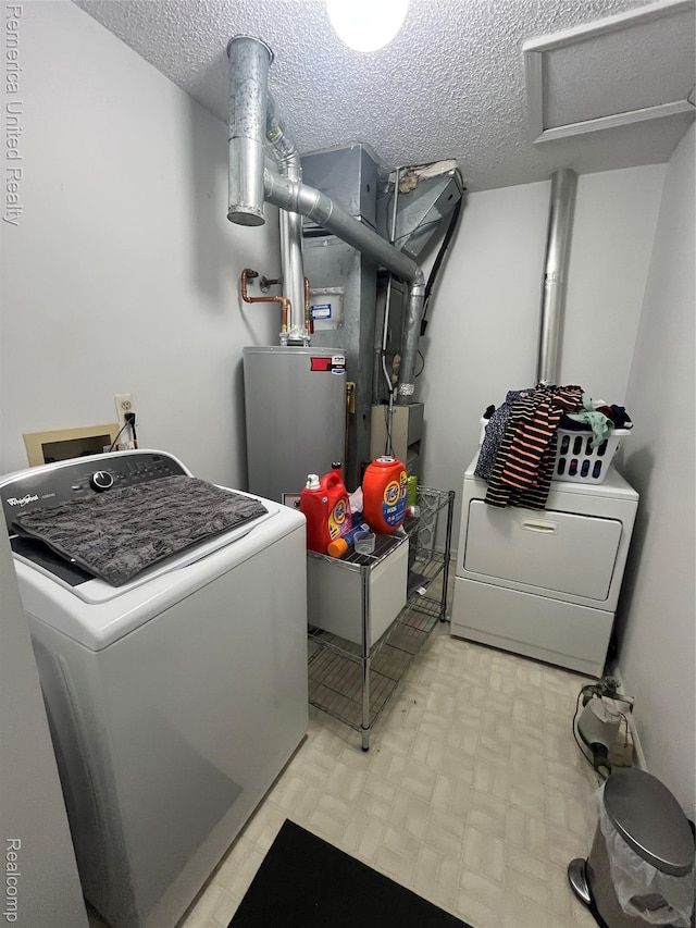 35754 Castlewood Ct, Westland, MI 48185 - laundry room with gas water heater, washer and clothes dryer, and a textured ceiling
