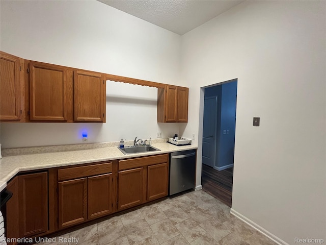 35754 Castlewood Ct, Westland, MI 48185 - kitchen with stainless steel dishwasher, light countertops, and brown cabinets