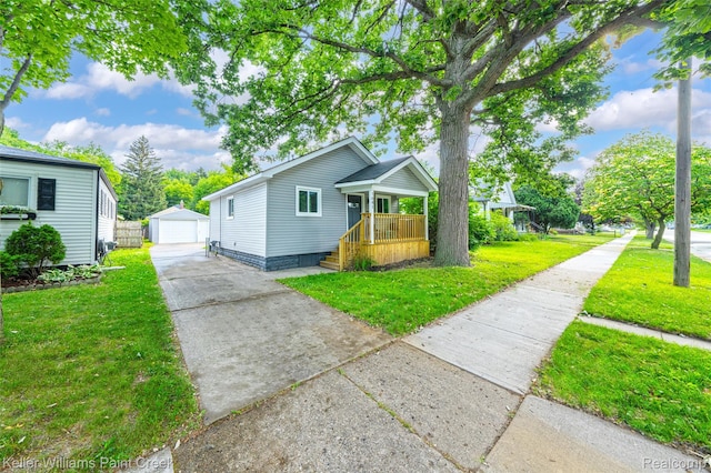 1641 Silman St, Ferndale, MI 48220 - view of front of house with an outdoor structure, driveway, a front yard, and a detached garage