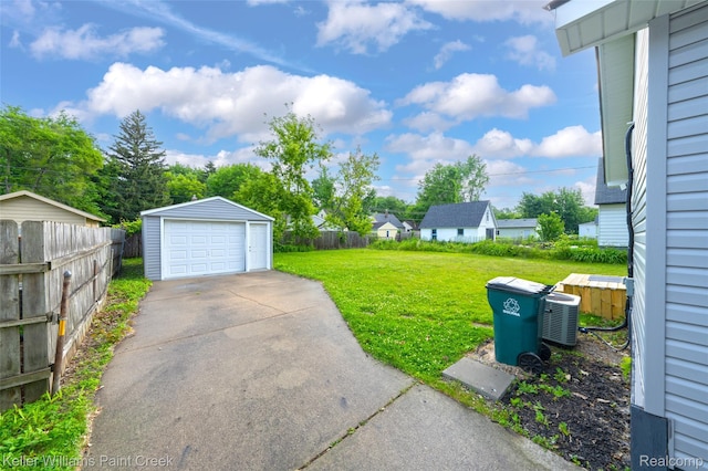1641 Silman St, Ferndale, MI 48220 - view of yard featuring a detached garage, driveway, and an outdoor structure